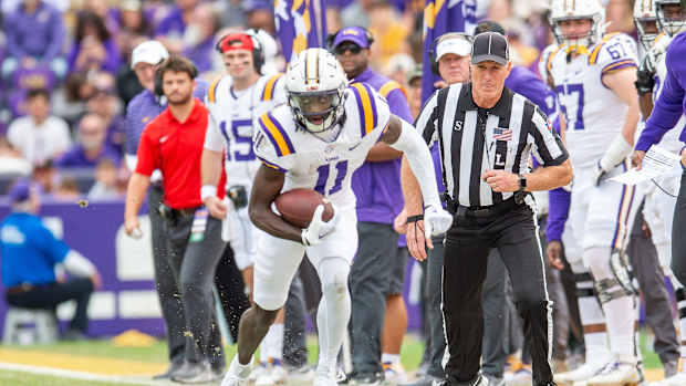 Brian Thomas Jr 11 runs the ball as the LSU Tigers take on Texas A&M in Tiger Stadium in Baton Rouge, Louisiana, November 25, 2023.